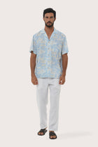 By The Sea Bali Chalet Shirt in Coconut Island Light Blue — relaxed camp-collar shirt in a tropical coconut print