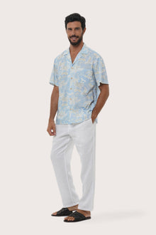 Side profile of the Chalet Coconut Island Light Blue Shirt showing its breathable, relaxed fit by By The Sea Bali