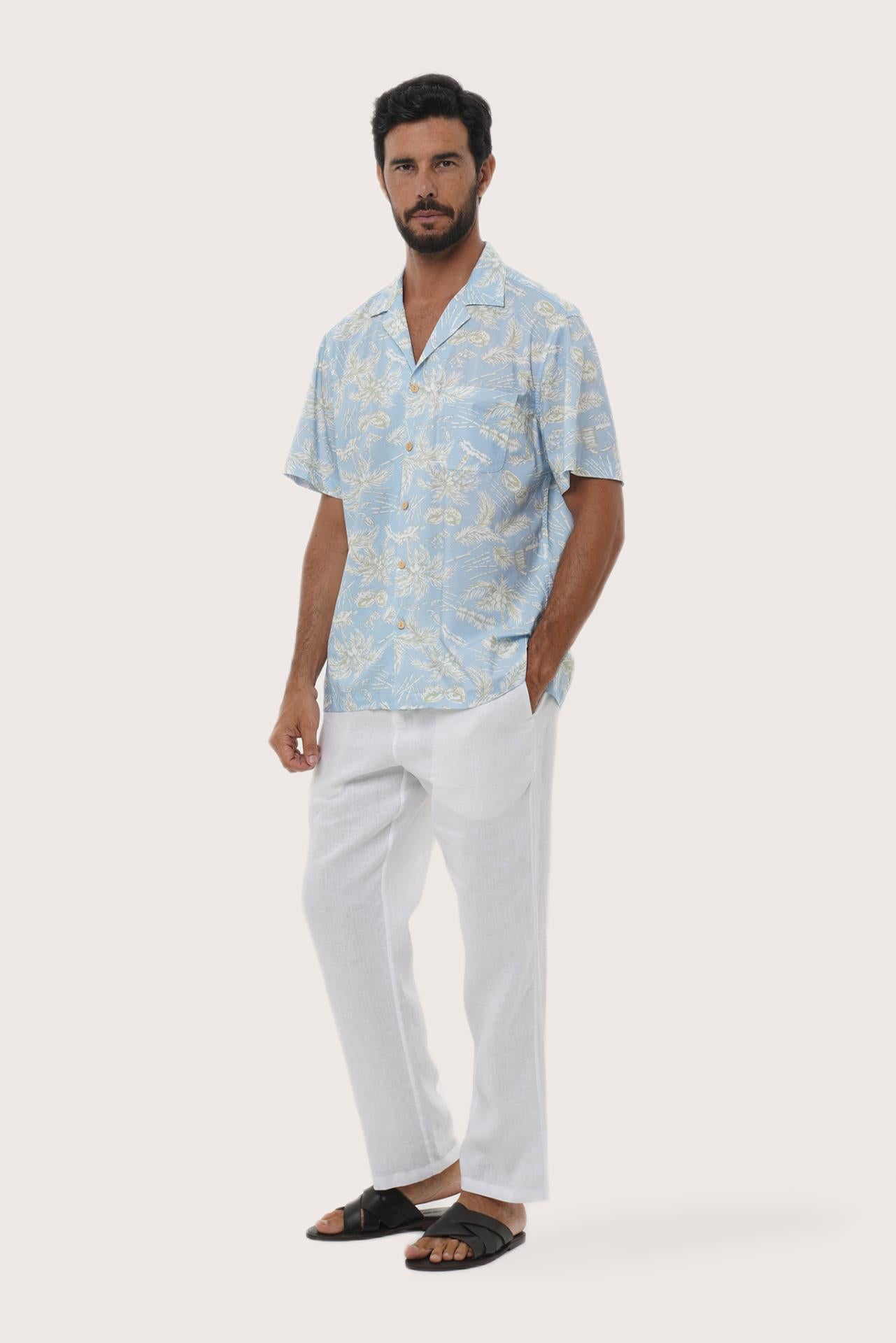 Close-up of the Coconut Island print on the Light Blue Chalet Shirt by By The Sea Bali