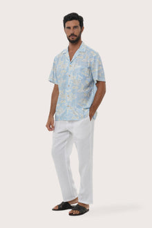 Close-up of the Coconut Island print on the Light Blue Chalet Shirt by By The Sea Bali