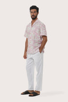 Close-up of the Coconut Island print on the Light Pink Chalet Shirt by By The Sea Bali