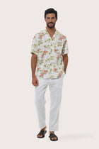 Front view of the Chalet Shirt Island Rhythm in White by By The Sea Bali, styled for effortless summer dressing