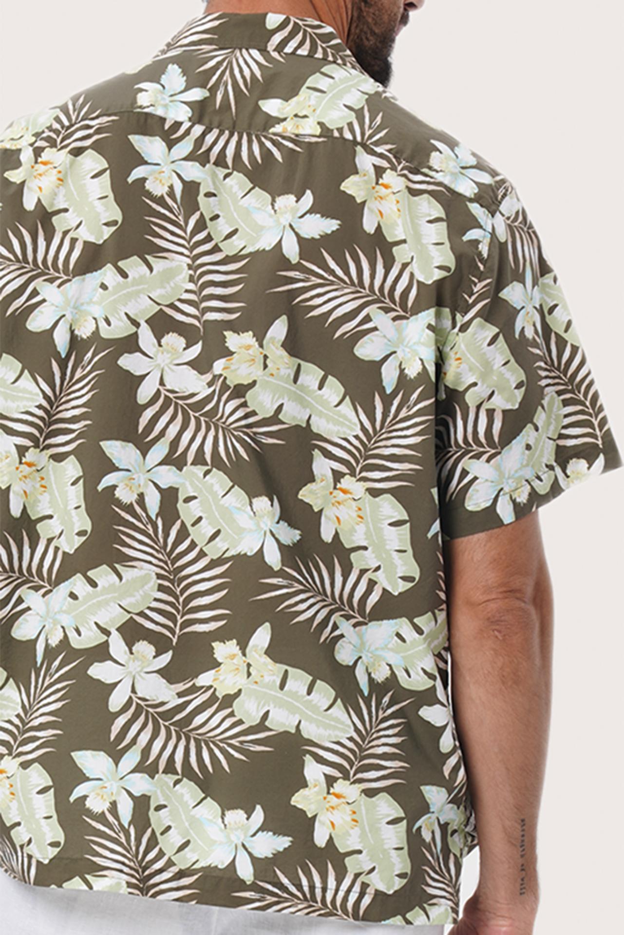 Open camp collar and button-front detail of the Chalet Shirt in Monstrea Army by By The Sea Bali