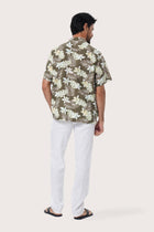 Close-up of the Monstrea Army monstera-leaf print on the Chalet Shirt by By The Sea Bali