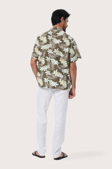 Close-up of the Monstrea Army monstera-leaf print on the Chalet Shirt by By The Sea Bali