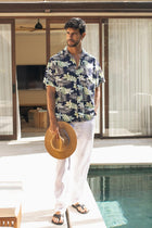By The Sea Bali Chalet Shirt in Monstrea Blue — tropical monstera-leaf print on a relaxed camp-collar shirt