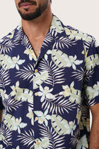 Open camp collar and button-front detail of the Chalet Shirt in Monstrea Blue by By The Sea Bali