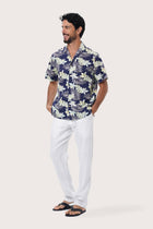 Close-up of the Monstrea Blue monstera-leaf print on the Chalet Shirt by By The Sea Bali