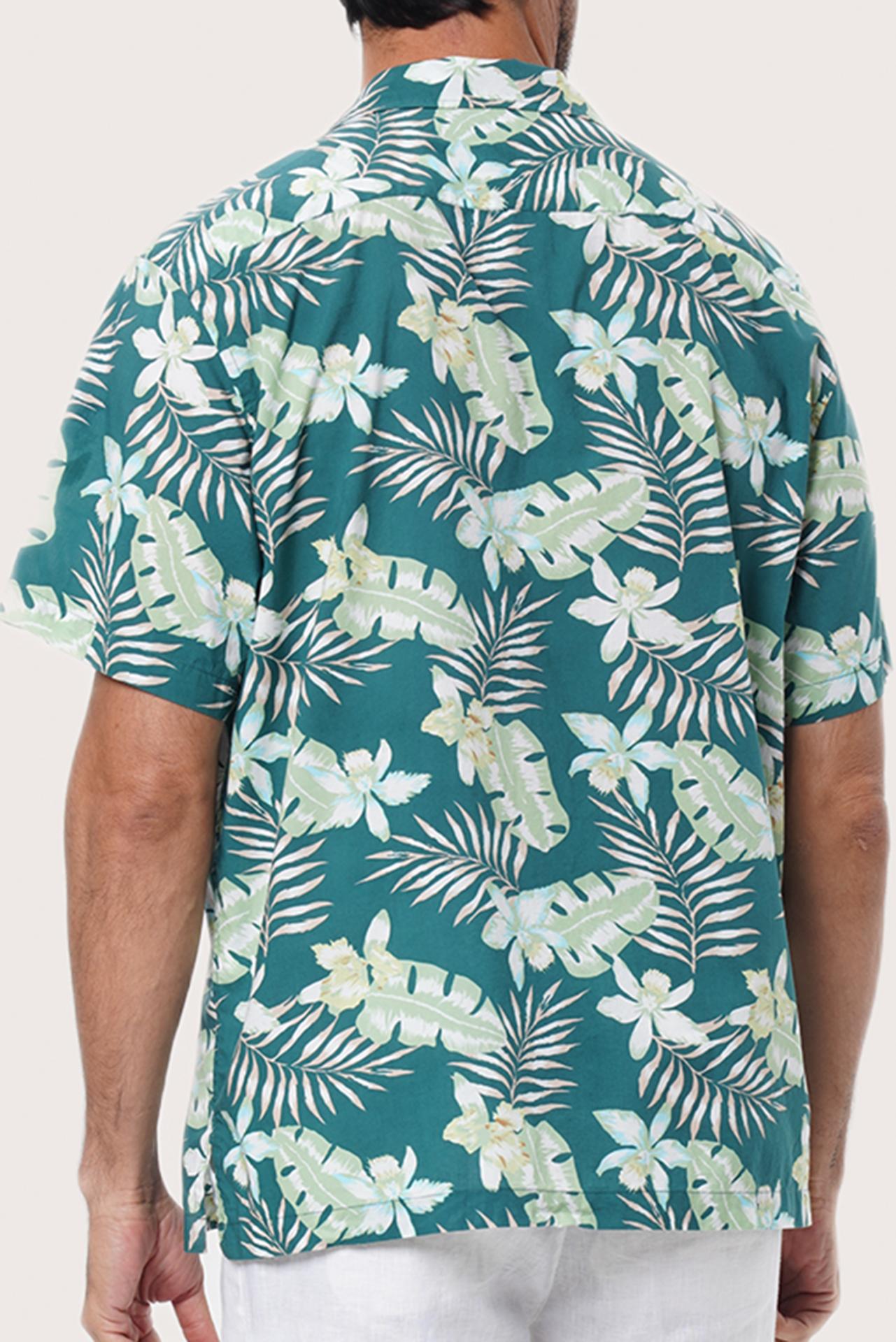 Open camp collar and button-front detail of the Chalet Shirt in Monstrea Green by By The Sea Bali
