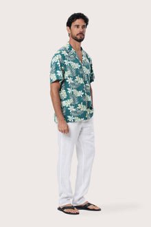 Front view of the Chalet Shirt in Monstrea Green print by By The Sea Bali, an easy resortwear staple