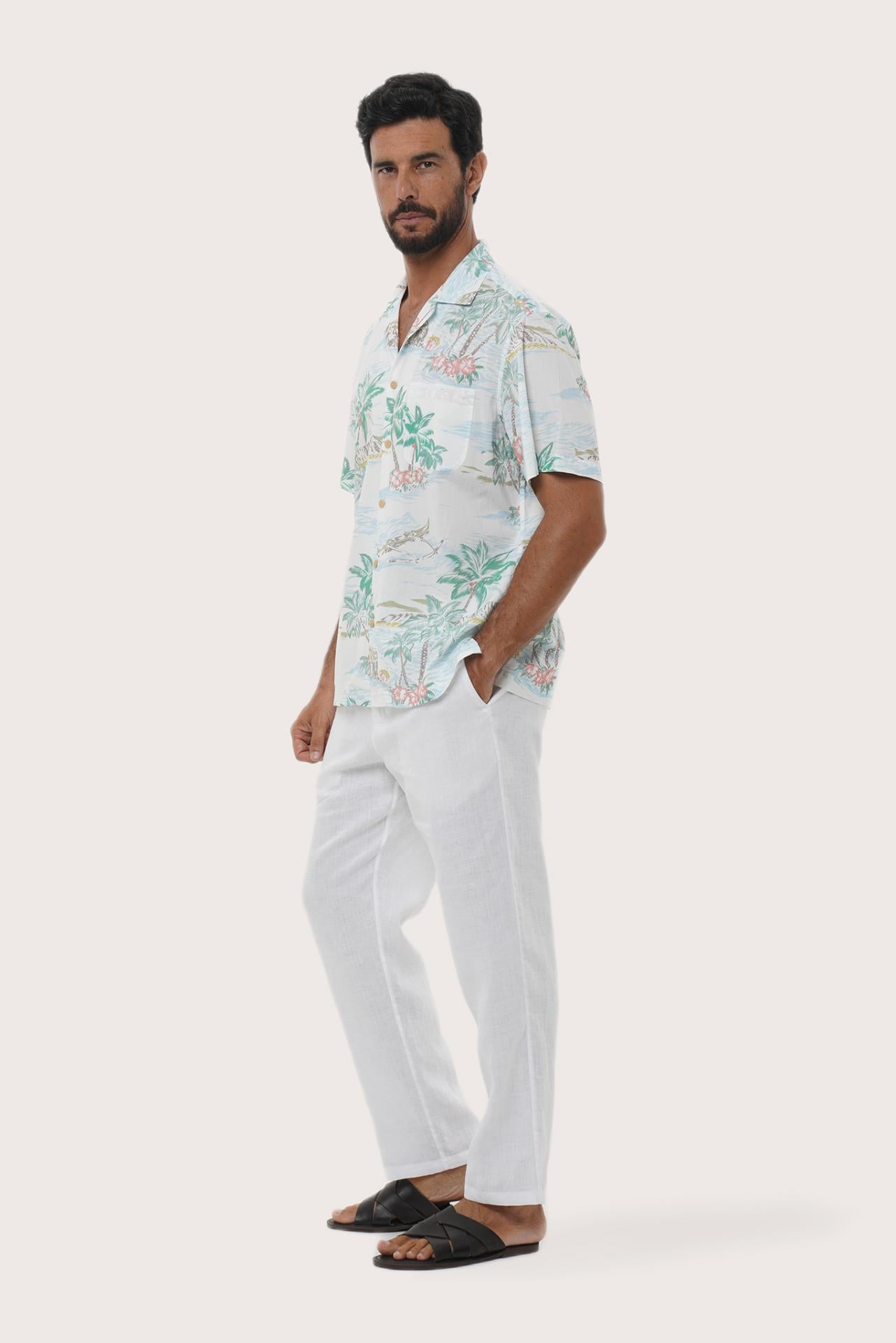 Side profile of the Chalet Tropical Day White Shirt showing its breathable, relaxed fit by By The Sea Bali