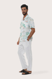 Side profile of the Chalet Tropical Day White Shirt showing its breathable, relaxed fit by By The Sea Bali