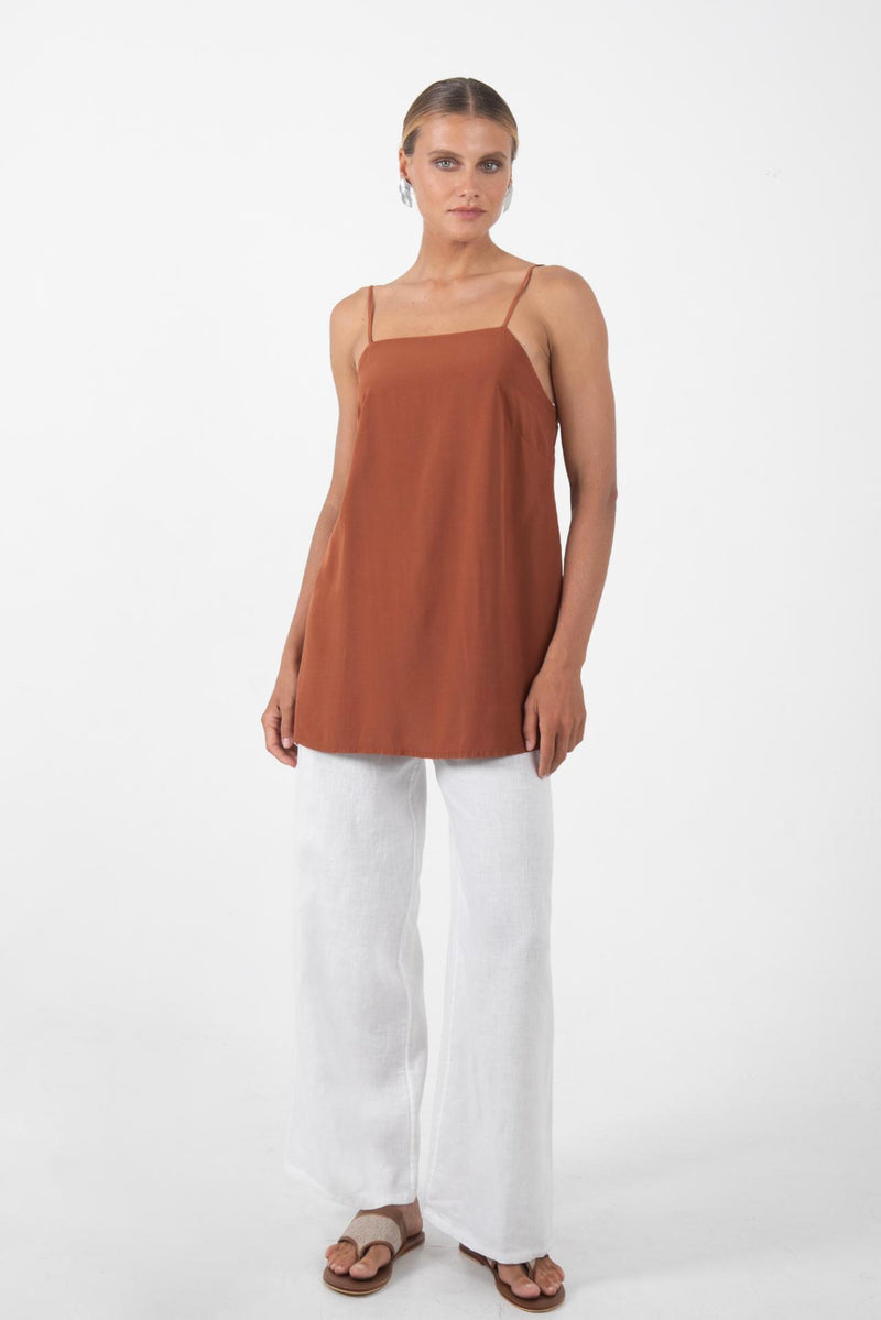 Women's brick red rayon top featuring a relaxed modern silhouette with soft lightweight fabric for effortless resort wear and tropical summer styling by By The Sea Bali