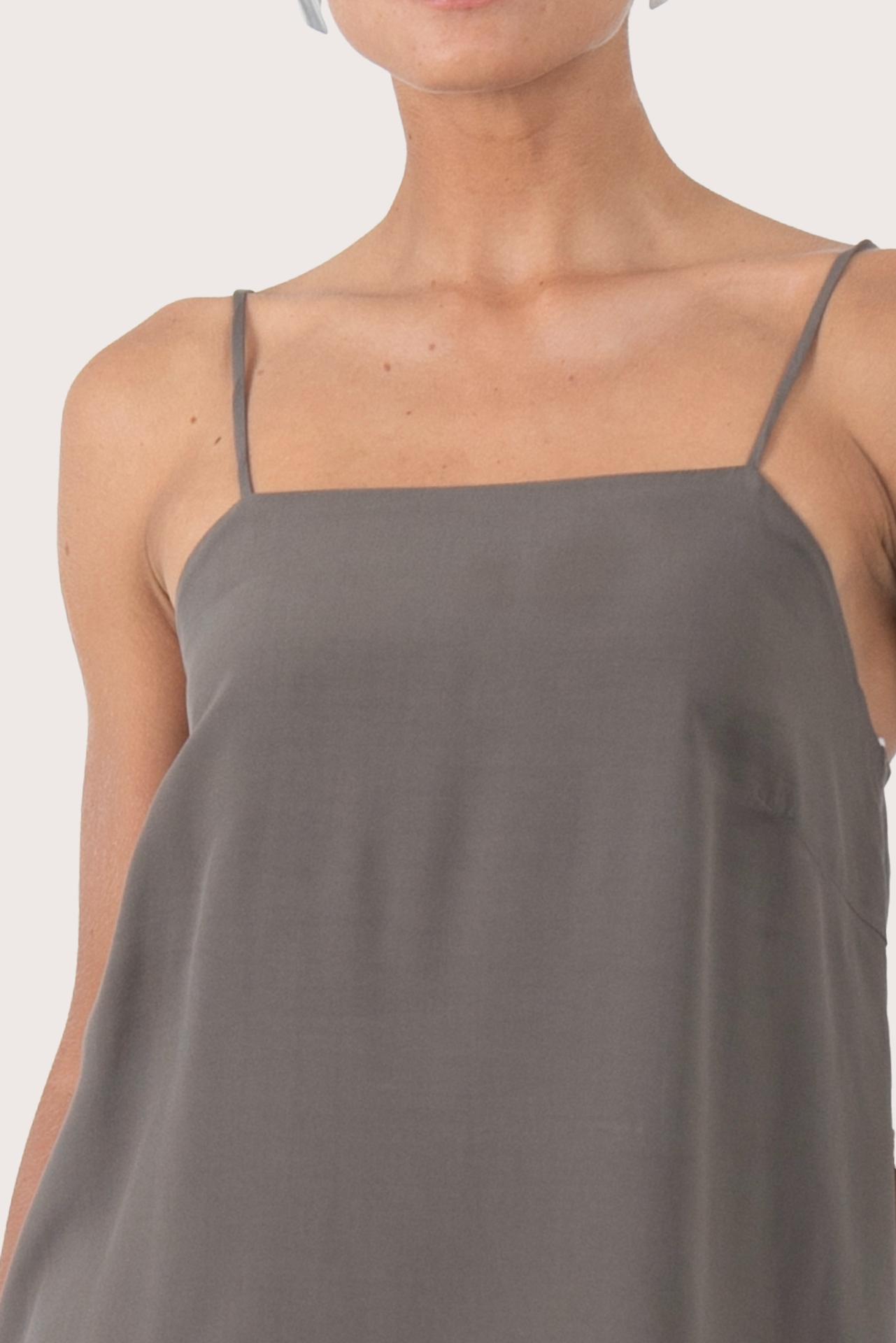 Close up front view of the grey rayon top showcasing the relaxed fit, clean neckline and minimal modern design