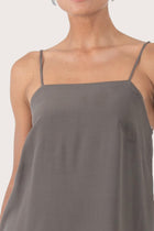 Close up front view of the grey rayon top showcasing the relaxed fit, clean neckline and minimal modern design