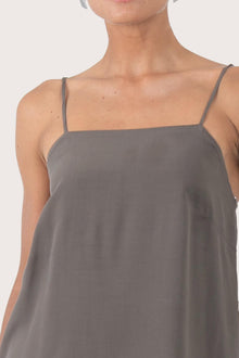 Close up front view of the grey rayon top showcasing the relaxed fit, clean neckline and minimal modern design