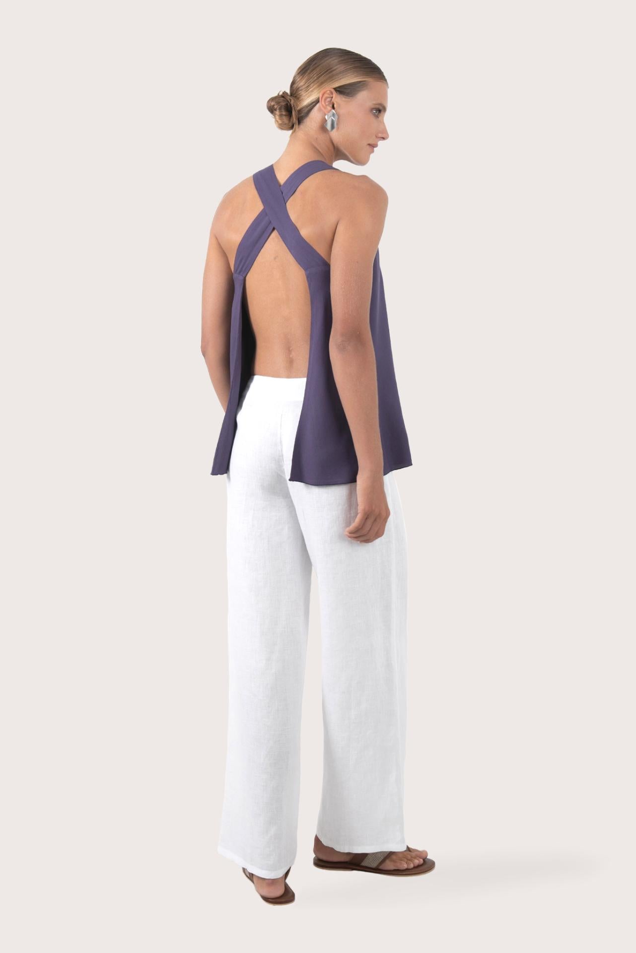 Back view highlighting the open-back design with cross straps and lightweight rayon fabric