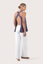 Back view highlighting the open-back design with cross straps and lightweight rayon fabric