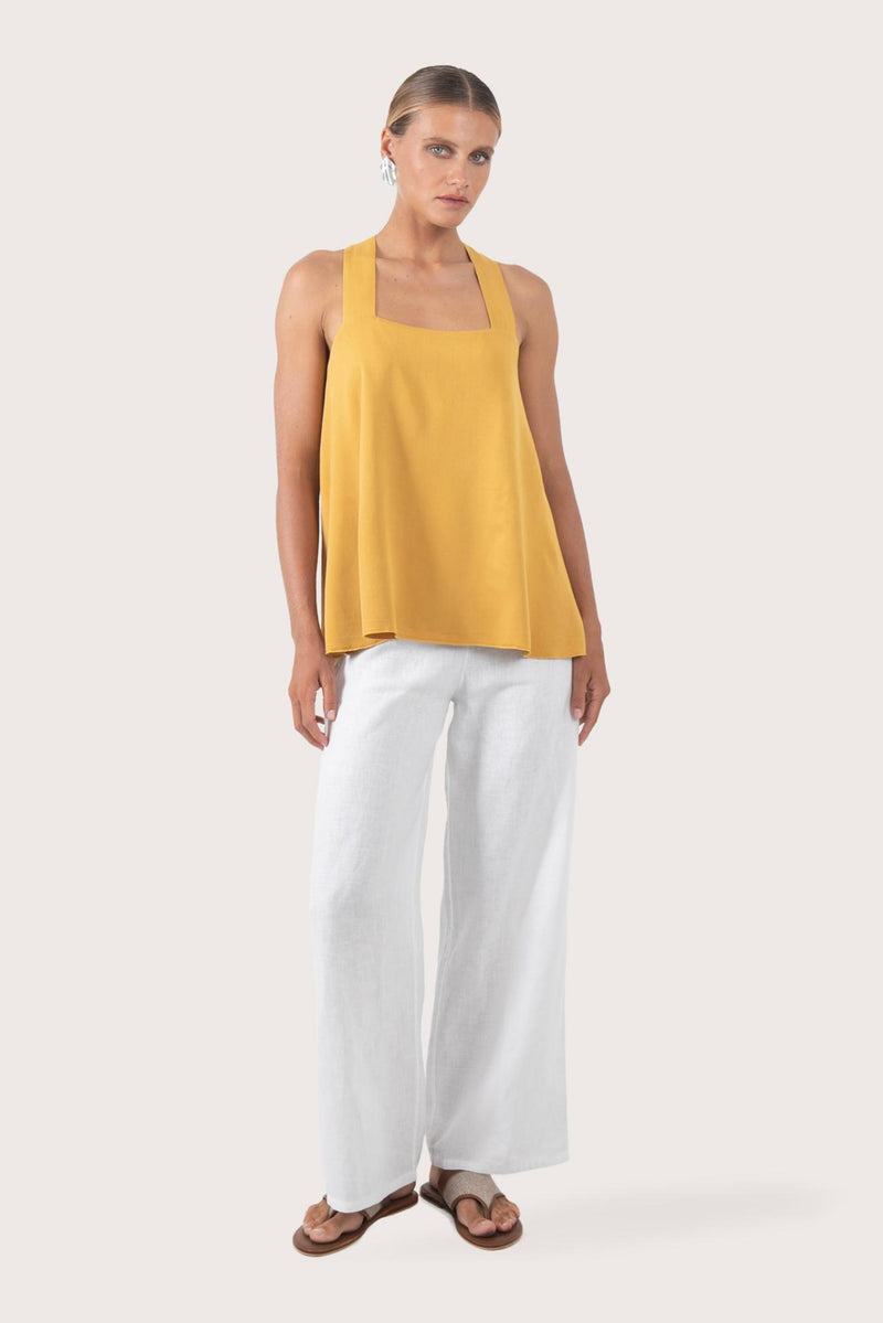 Front view of the yellow rayon top showcasing the relaxed silhouette, clean neckline and airy fit by By The Sea Bali