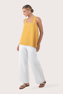 Side profile showing the relaxed drape and breathable loose fit of the rayon top
