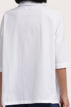 Back view detail of the Daria Cotton Shirt White highlighting the garment shape and drape.