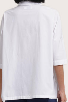 Back view detail of the Daria Cotton Shirt White highlighting the garment shape and drape.