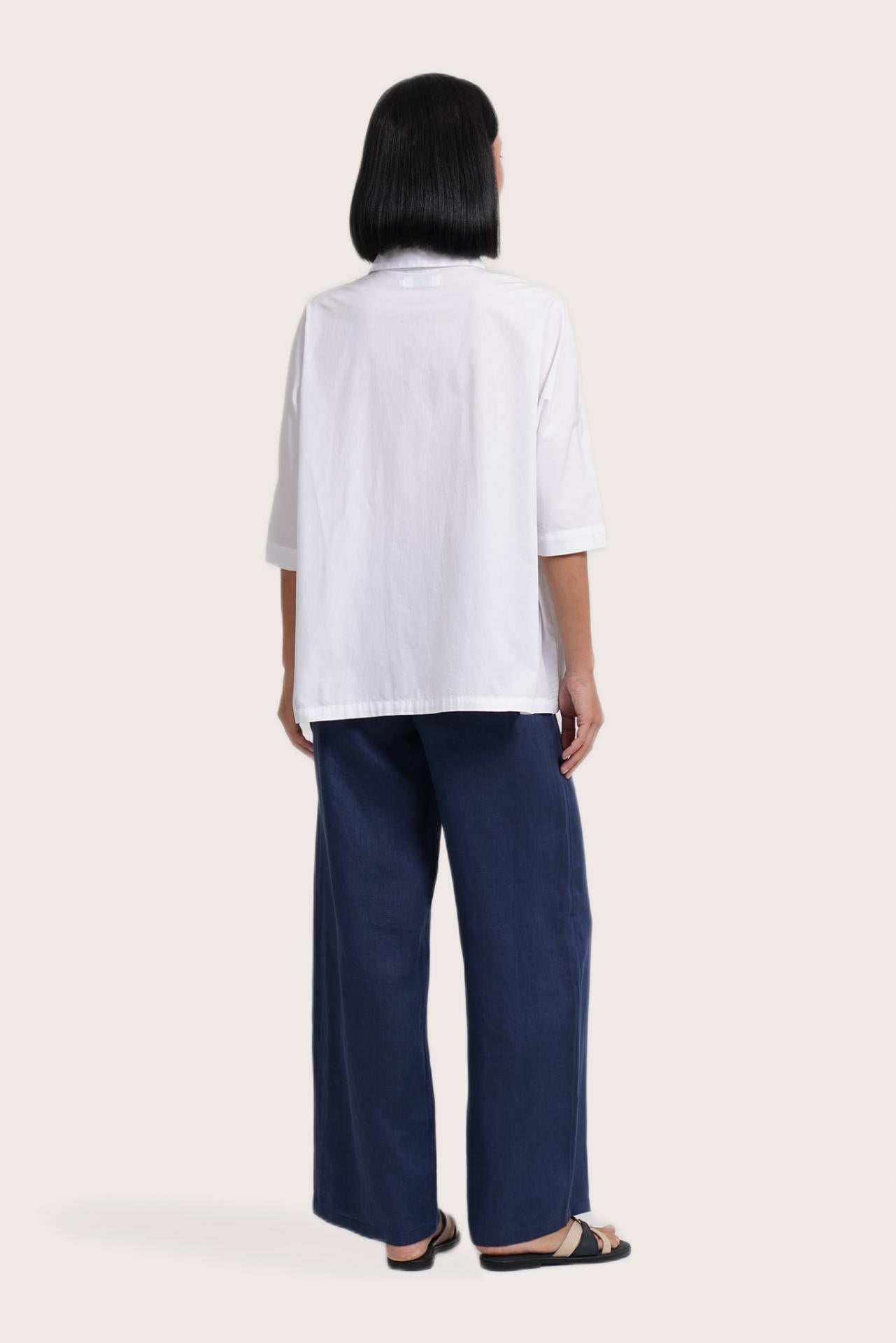 Back view of the Daria Cotton Shirt White highlighting the garment shape and drape.