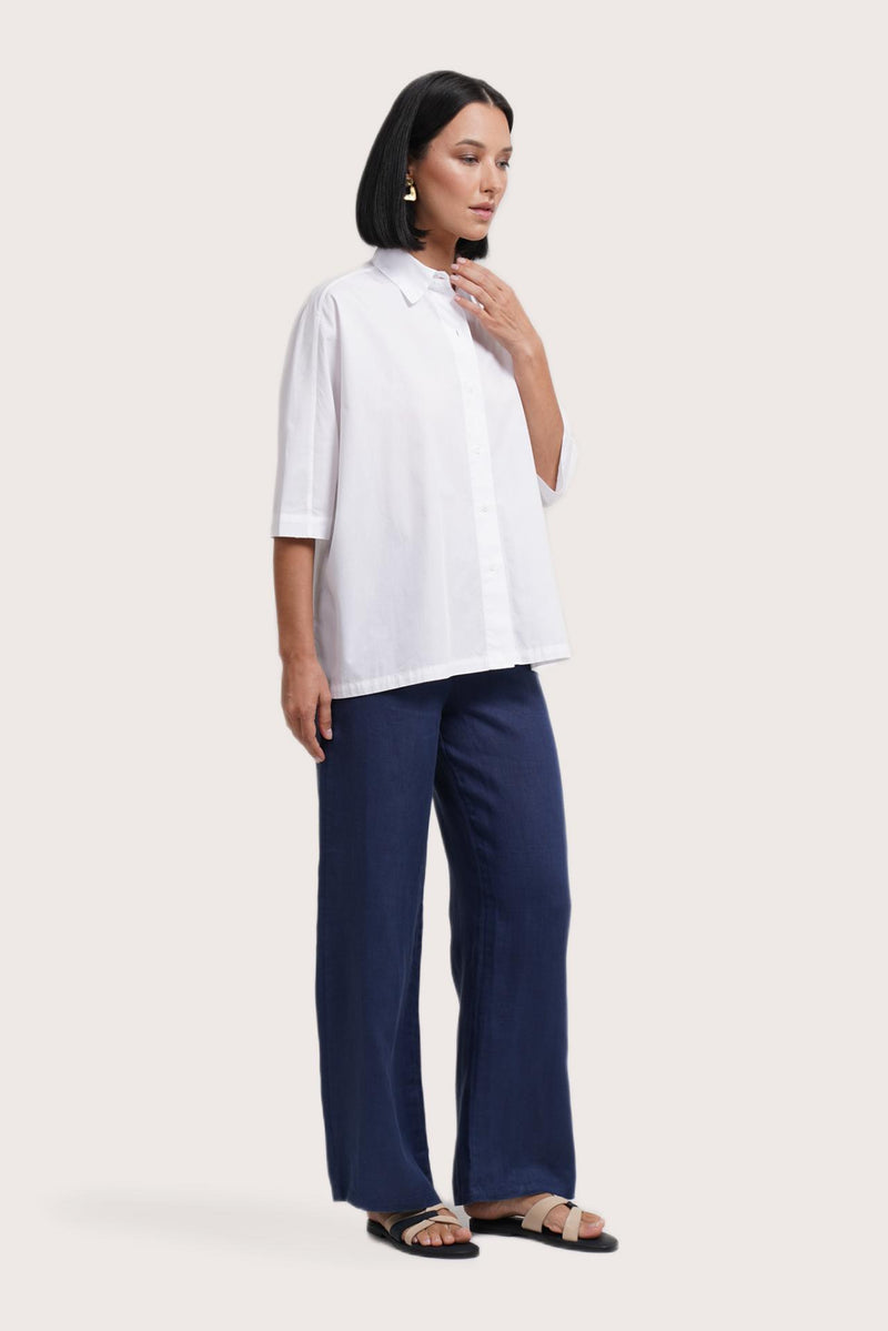 Side profile of the Daria Cotton Shirt White showing its cut and natural movement.