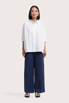 Woman wearing the Daria Cotton Shirt designed for effortless resortwear and tropical living by By The Sea Bali.