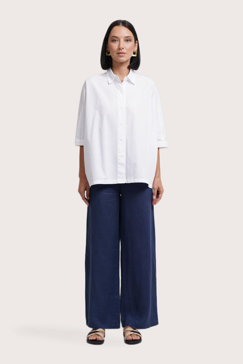 Woman wearing the Daria Cotton Shirt designed for effortless resortwear and tropical living by By The Sea Bali.