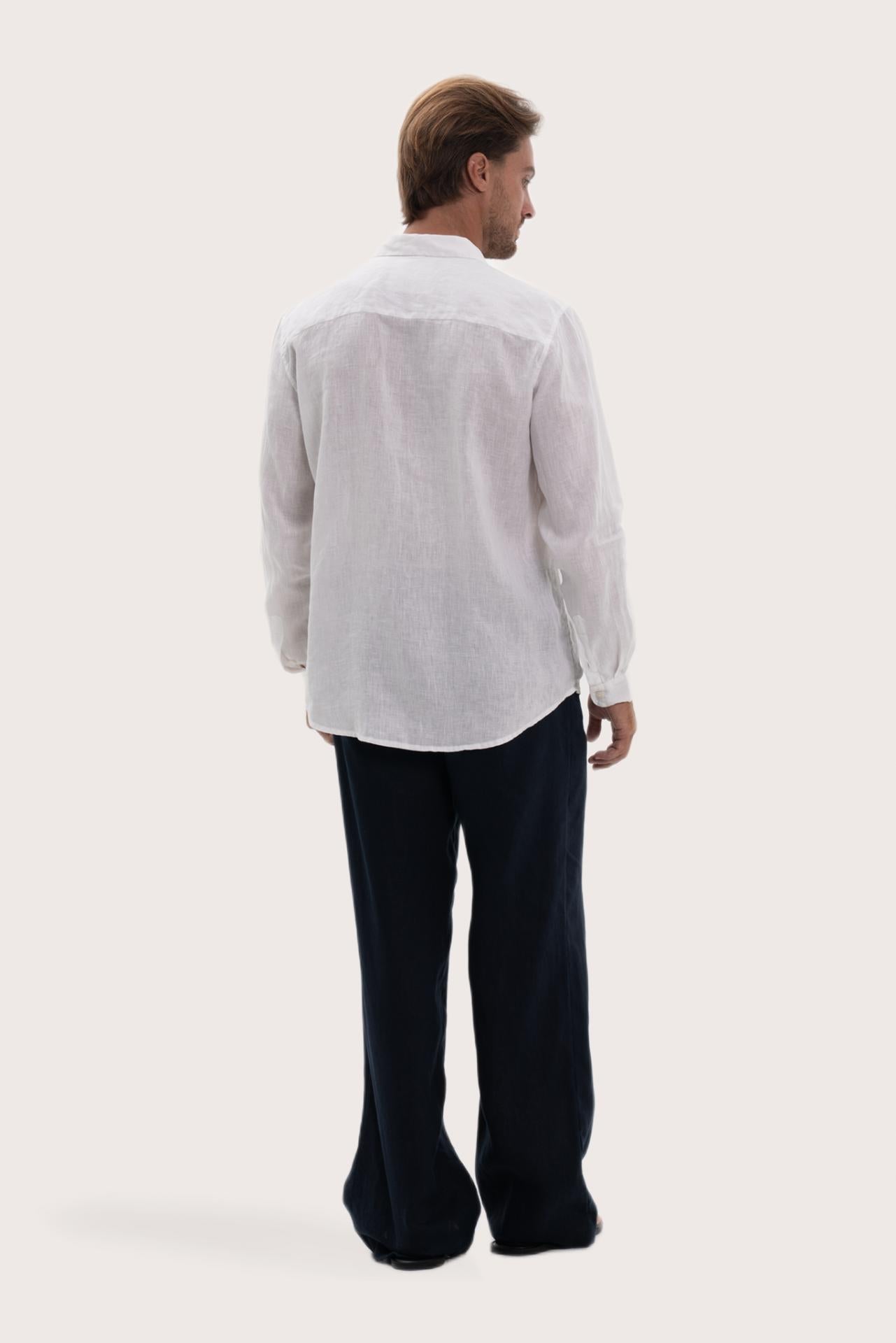 Back view of the white linen shirt with a relaxed and timeless silhouette