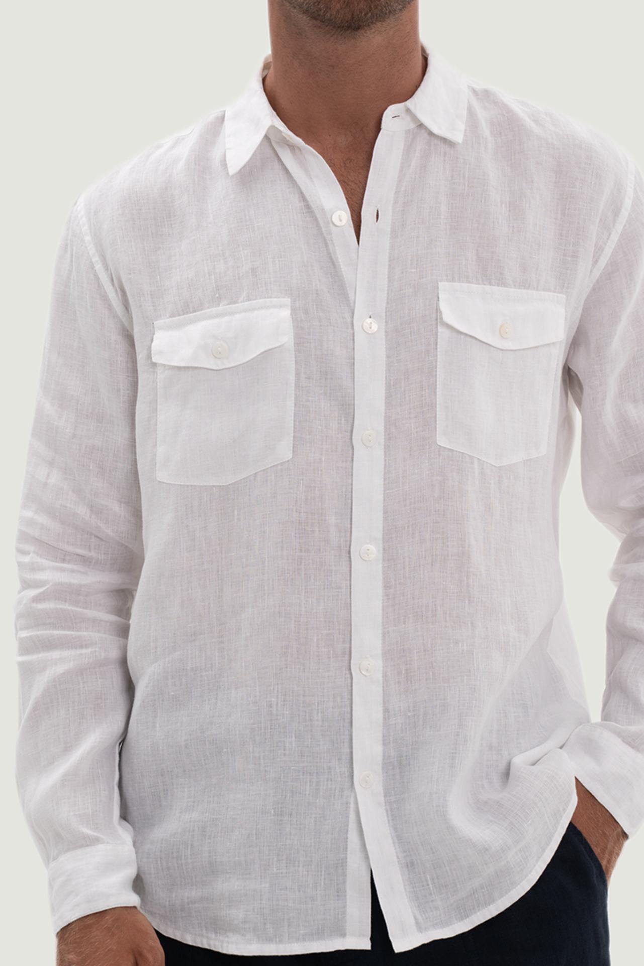 Close-up of the linen fabric texture and refined tailoring details on the white shirt