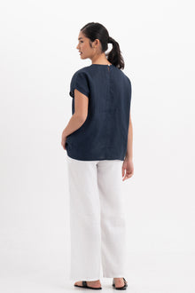 Back view of the Darya Linen Top Navy Blue highlighting the garment shape and drape.