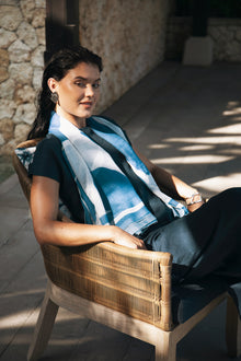 Woman wearing the Darya Linen Top Navy Blue designed for effortless resortwear and tropical living by By The Sea Bali.