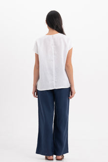 Back view of the Darya Linen Top White highlighting the garment shape and drape.