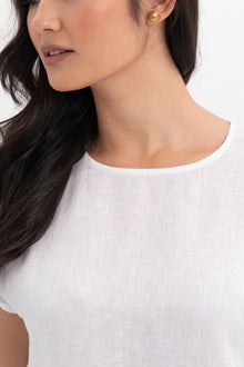 Close up detail of the Darya Linen Top White highlighting craftsmanship and design features.