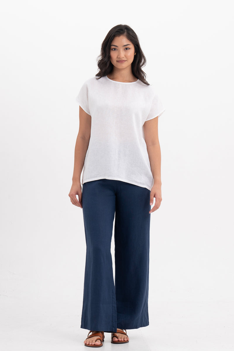 Front view of the Darya Linen Top White showcasing its silhouette and relaxed fit.
