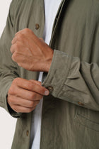 Collar and front-closure detail of the Grey Brown Dero Jacket by By The Sea Bali