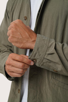 Collar and front-closure detail of the Grey Brown Dero Jacket by By The Sea Bali