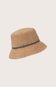 Model wearing the natural straw Dewy hat with a grey ribbon by By The Sea Bali