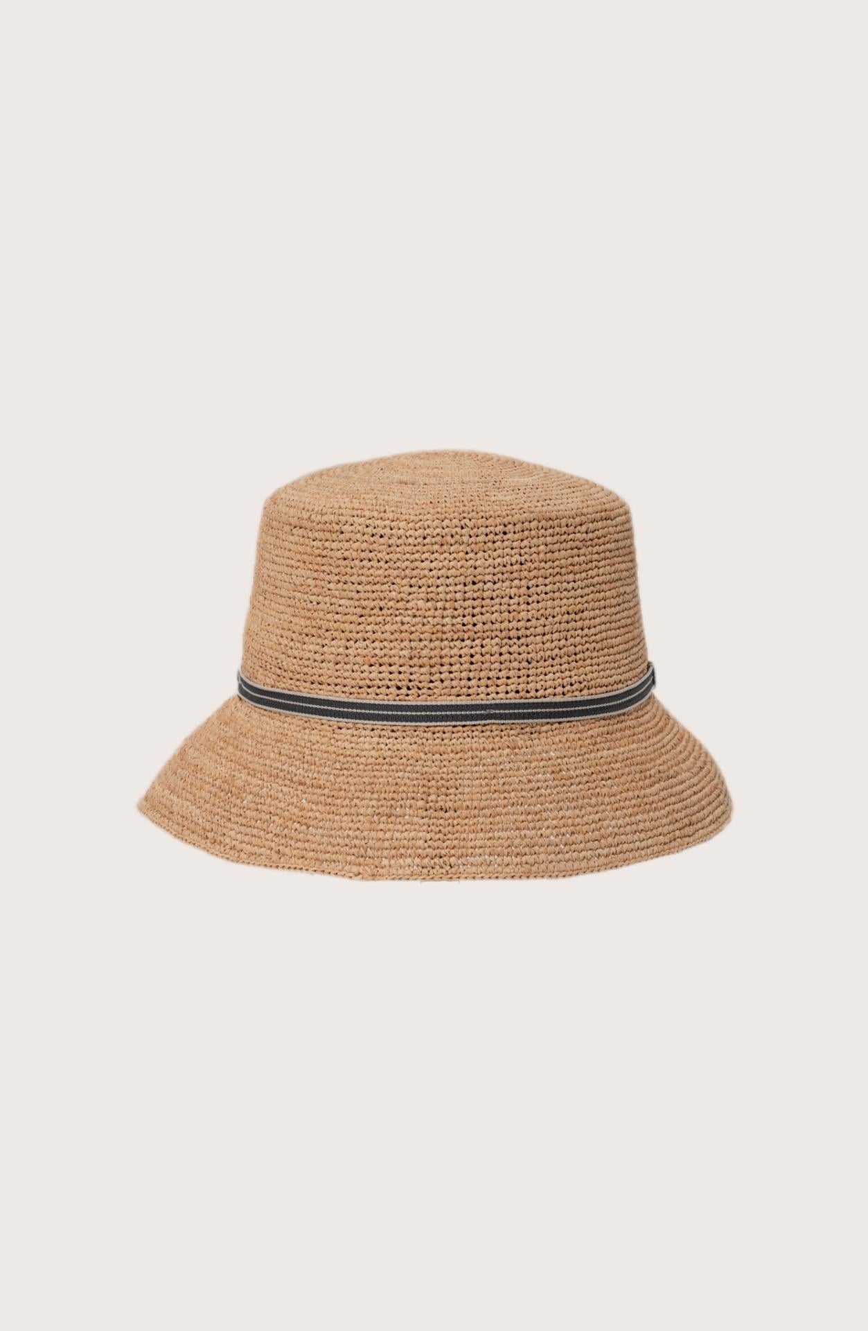 Side profile of the natural straw Dewy hat showcasing its classic wide-brim silhouette