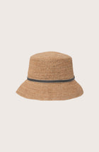 Side profile of the natural straw Dewy hat showcasing its classic wide-brim silhouette