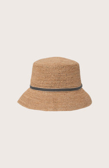 Side profile of the natural straw Dewy hat showcasing its classic wide-brim silhouette