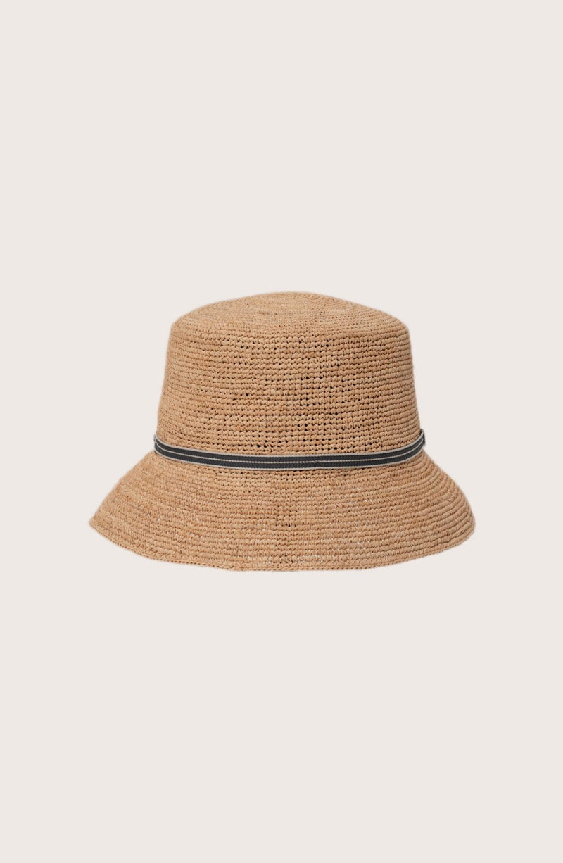Side profile of the natural straw Dewy hat showcasing its classic wide-brim silhouette