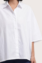 Front view detail of the Egra Loose Cotton Shirt White showcasing its silhouette and relaxed fit.