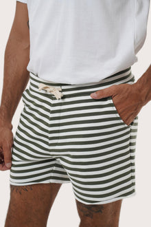 Close-up of the green stripe pattern on the Esco Bermuda Shorts by By The Sea Bali