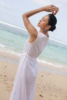 Woman wearing the Eva Linen Midi Dress White designed for effortless resortwear and tropical living  by By The Sea Bali