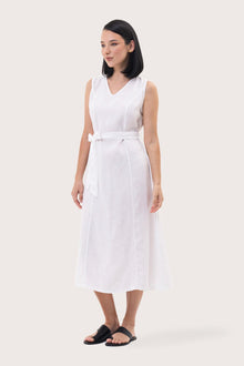 Side profile of the Eva Linen Midi Dress White showing its cut and natural movement