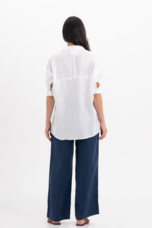 Back view of the Faye Linen Shirt White highlighting the garment shape and drape.