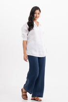 Side profile of the Faye Linen Shirt  White showing its cut and natural movement.